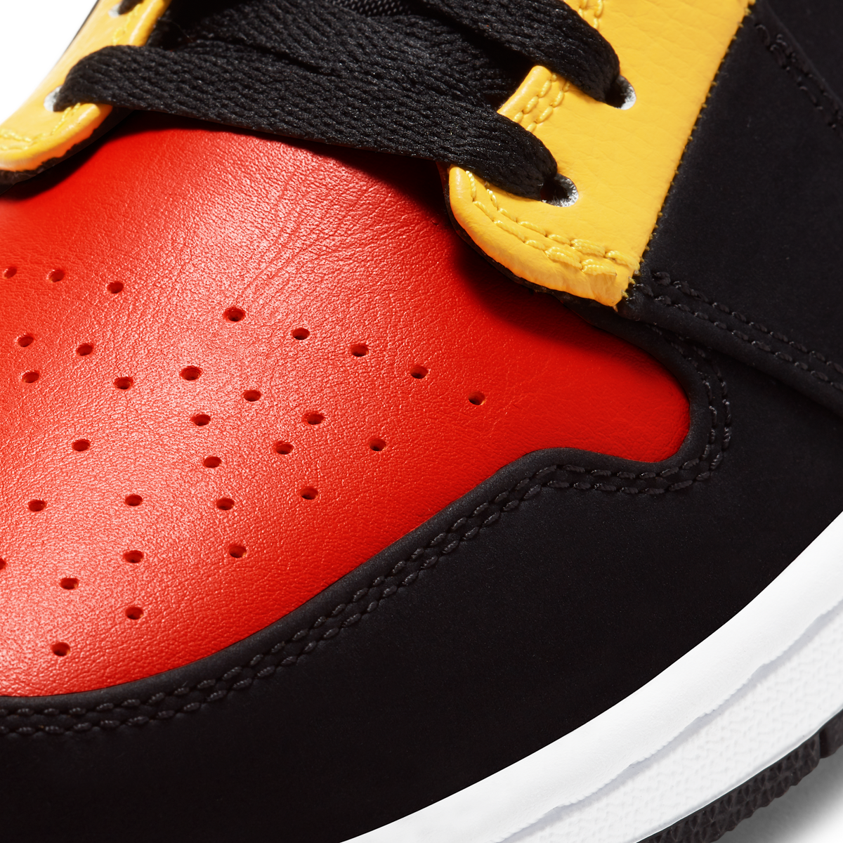 Jordan 1 Mid Black Amarillo Orange