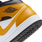 Jordan 1 Mid University Gold